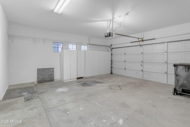 garage featuring a garage door opener