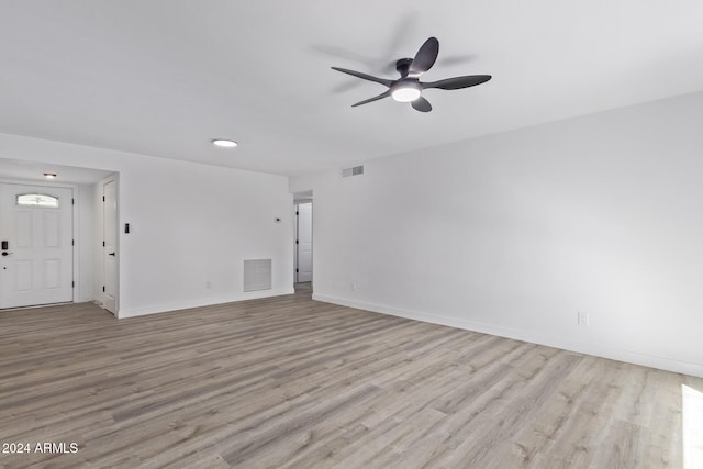 unfurnished living room featuring light hardwood / wood-style flooring and ceiling fan