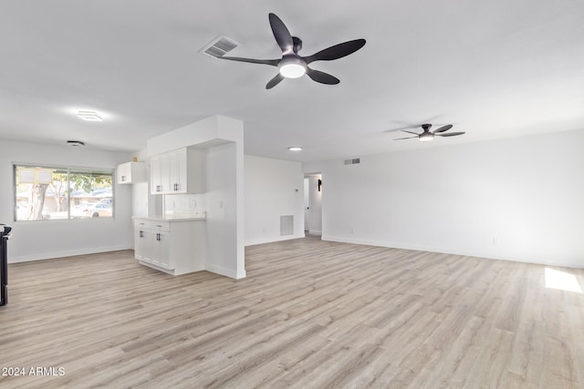 unfurnished living room with light hardwood / wood-style flooring and ceiling fan