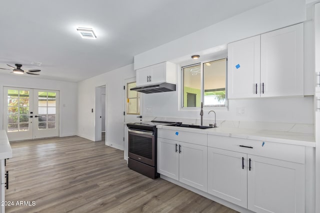 kitchen with white cabinetry, french doors, sink, stainless steel electric range, and light wood-type flooring