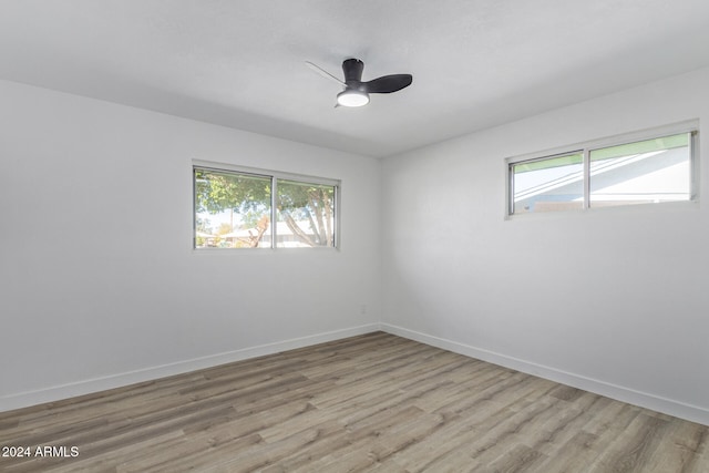 unfurnished room with light hardwood / wood-style flooring and ceiling fan