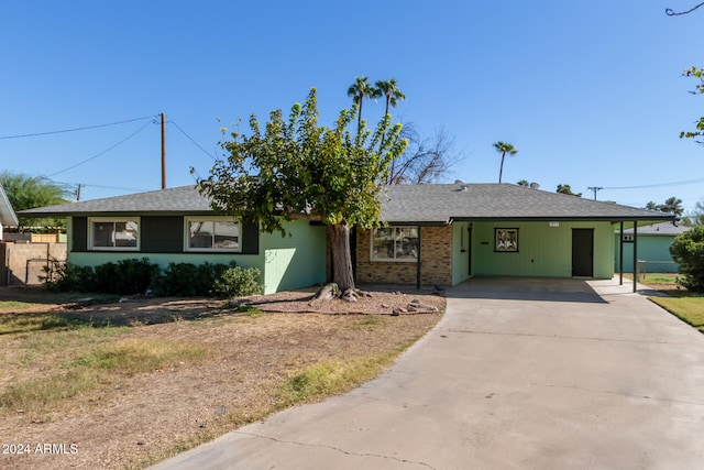 single story home with a carport