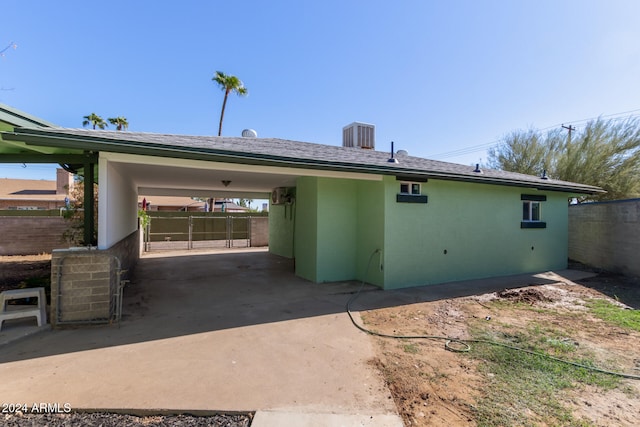 rear view of property featuring a carport