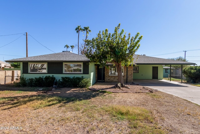 single story home featuring a carport