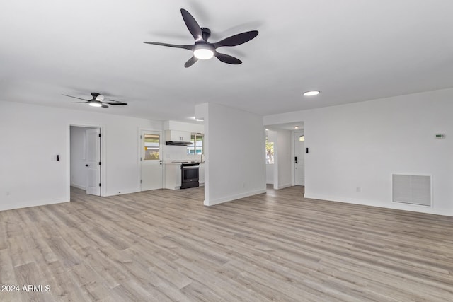 unfurnished living room with light hardwood / wood-style flooring and ceiling fan