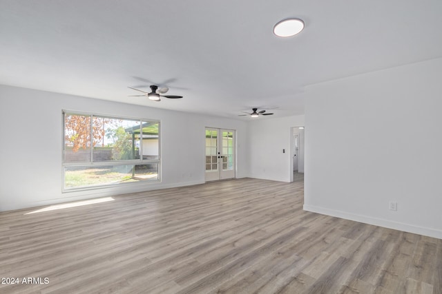 spare room featuring french doors, light hardwood / wood-style flooring, and ceiling fan