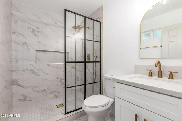 full bathroom featuring a marble finish shower, marble finish floor, toilet, and vanity