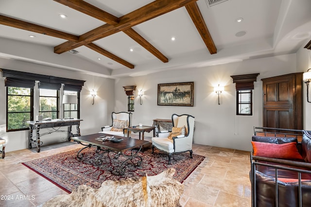 living room featuring vaulted ceiling with beams