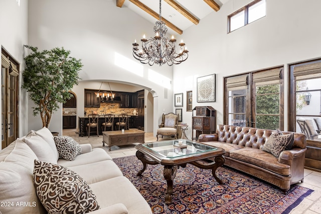 living room with beam ceiling, high vaulted ceiling, and light tile patterned flooring