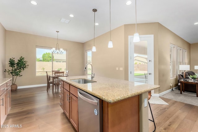7630 E Knoll St, Mesa, AZ 85207 - kitchen with brown cabinetry, light wood-style floors, a sink, light stone countertops, and dishwasher