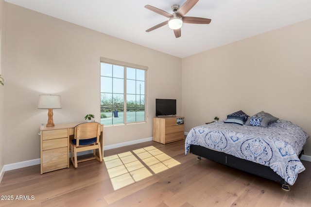 7630 E Knoll St, Mesa, AZ 85207 - bedroom with ceiling fan, baseboards, and wood finished floors