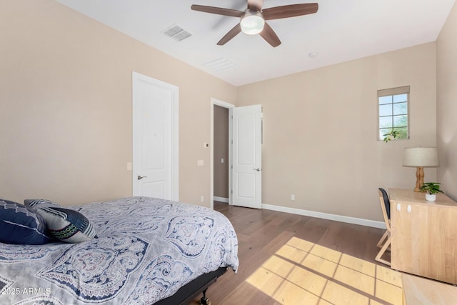 7630 E Knoll St, Mesa, AZ 85207 - bedroom with visible vents, ceiling fan, baseboards, and wood finished floors