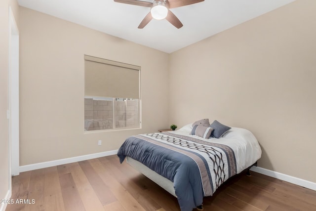 7630 E Knoll St, Mesa, AZ 85207 - bedroom featuring a ceiling fan, baseboards, and wood finished floors