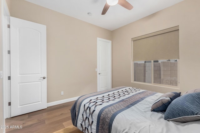 7630 E Knoll St, Mesa, AZ 85207 - bedroom featuring a ceiling fan, baseboards, and wood finished floors