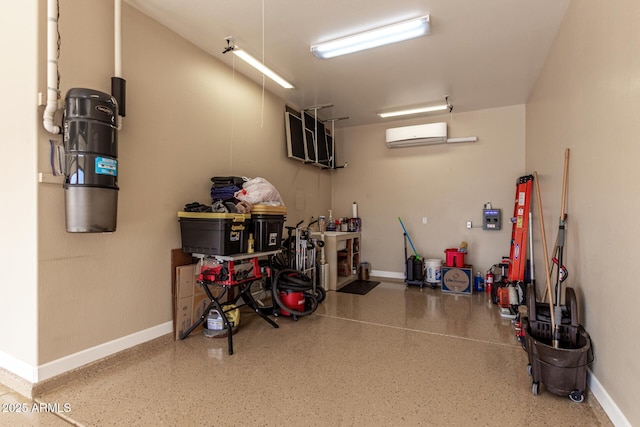 7630 E Knoll St, Mesa, AZ 85207 - garage featuring baseboards and a wall mounted AC