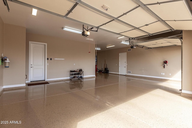 7630 E Knoll St, Mesa, AZ 85207 - garage with a garage door opener and baseboards