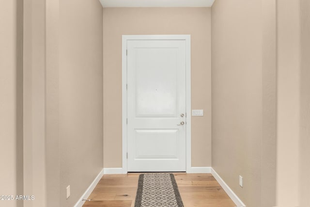 7630 E Knoll St, Mesa, AZ 85207 - doorway to outside with baseboards and light wood finished floors