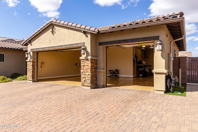 7630 E Knoll St, Mesa, AZ 85207 - view of front of home featuring a garage, a gate, decorative driveway, and stucco siding
