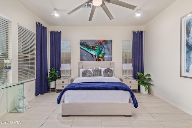 5218 N Tiller Dr, Litchfield Park, AZ 85340 - tiled bedroom featuring baseboards and a ceiling fan
