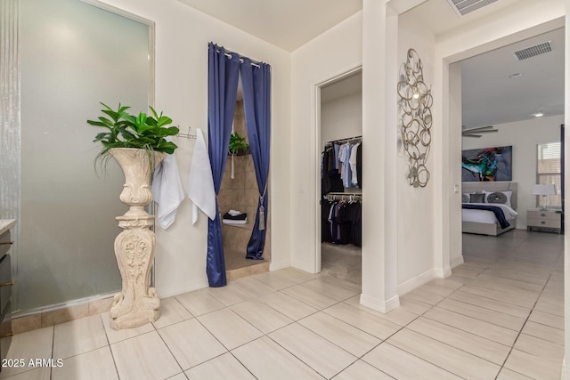 5218 N Tiller Dr, Litchfield Park, AZ 85340 - hall with light tile patterned floors and baseboards