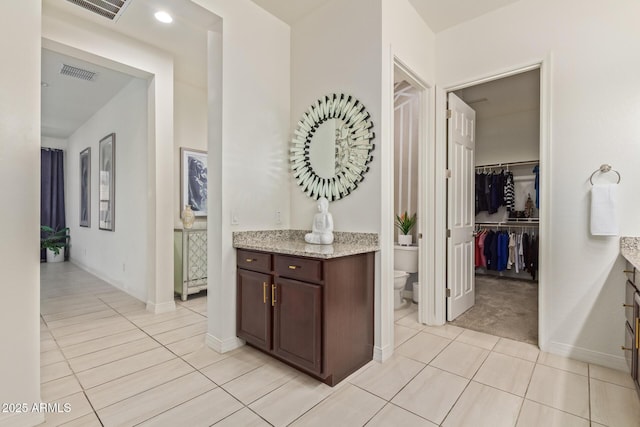 5218 N Tiller Dr, Litchfield Park, AZ 85340 - hall featuring light tile patterned floors and baseboards