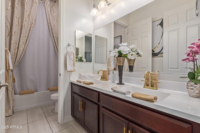 5218 N Tiller Dr, Litchfield Park, AZ 85340 - bathroom featuring toilet, double vanity, tile patterned flooring, and shower / bath combo