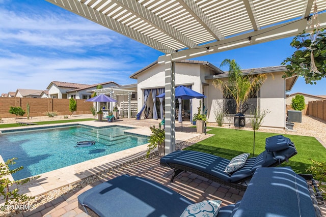 5218 N Tiller Dr, Litchfield Park, AZ 85340 - view of swimming pool featuring central AC, a fenced backyard, a pergola, and a patio
