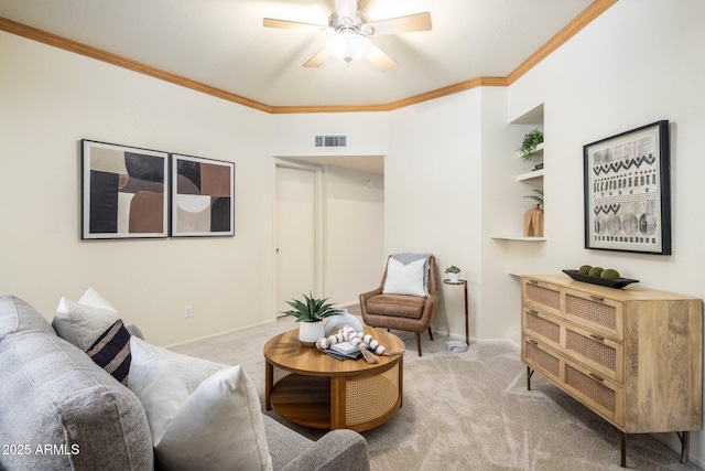 living room with crown molding, light colored carpet, visible vents, a ceiling fan, and baseboards