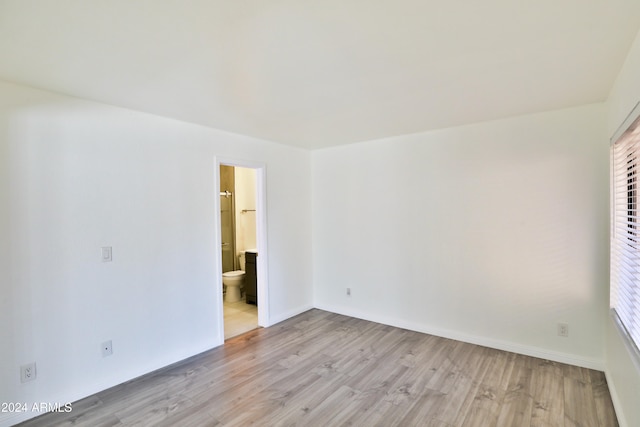 unfurnished room featuring light wood-type flooring