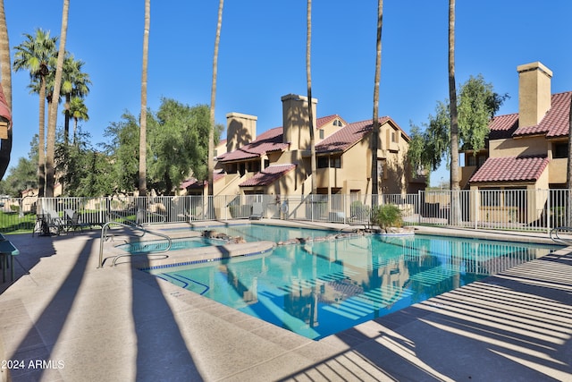 view of swimming pool featuring a patio area