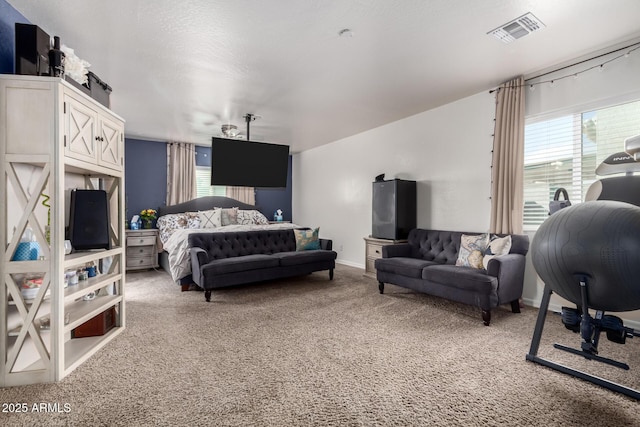 carpeted bedroom featuring multiple windows