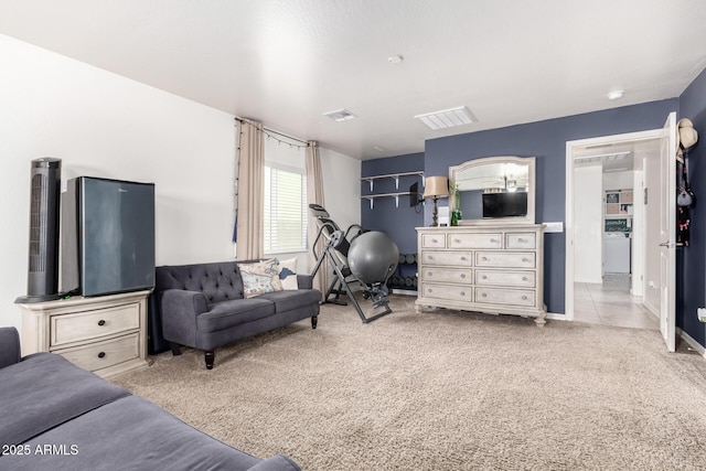 interior space with light carpet and washer / clothes dryer