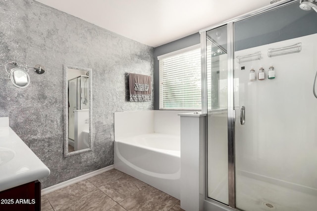 bathroom featuring vanity, tile patterned flooring, and separate shower and tub