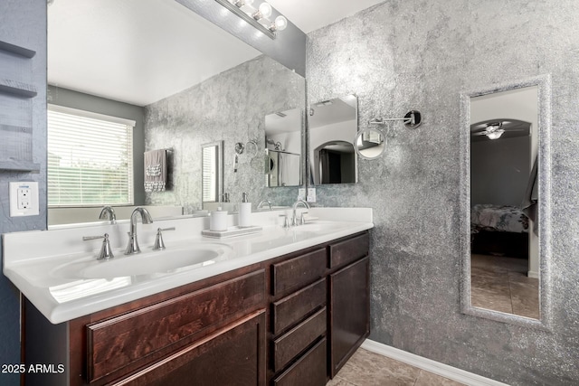 bathroom featuring tile patterned flooring and vanity