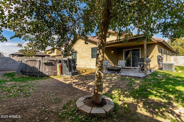 back of house featuring a patio and central AC