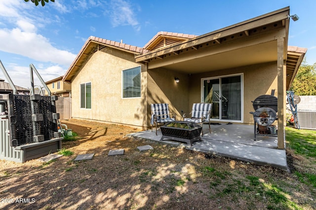 rear view of property with a patio area