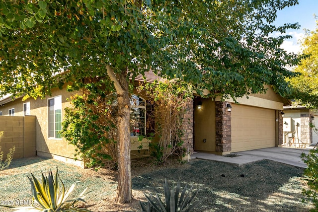 obstructed view of property featuring a garage