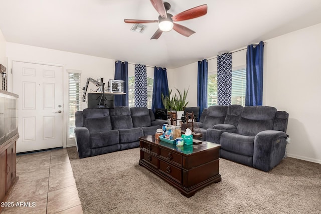 tiled living room featuring ceiling fan