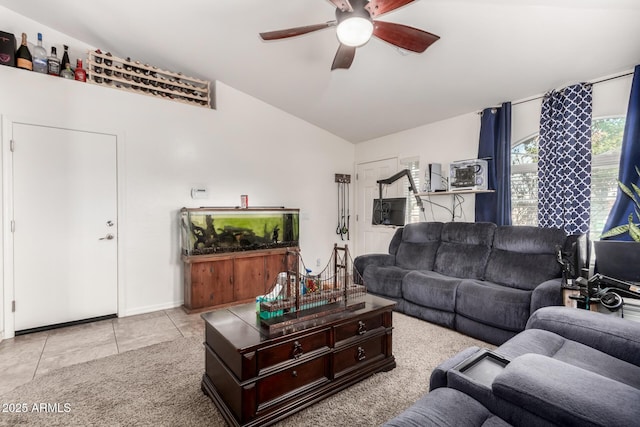 living room with light tile patterned flooring, lofted ceiling, and ceiling fan