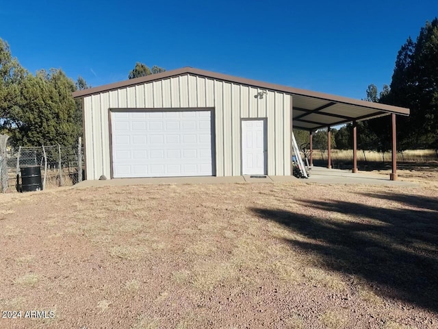 garage featuring a carport