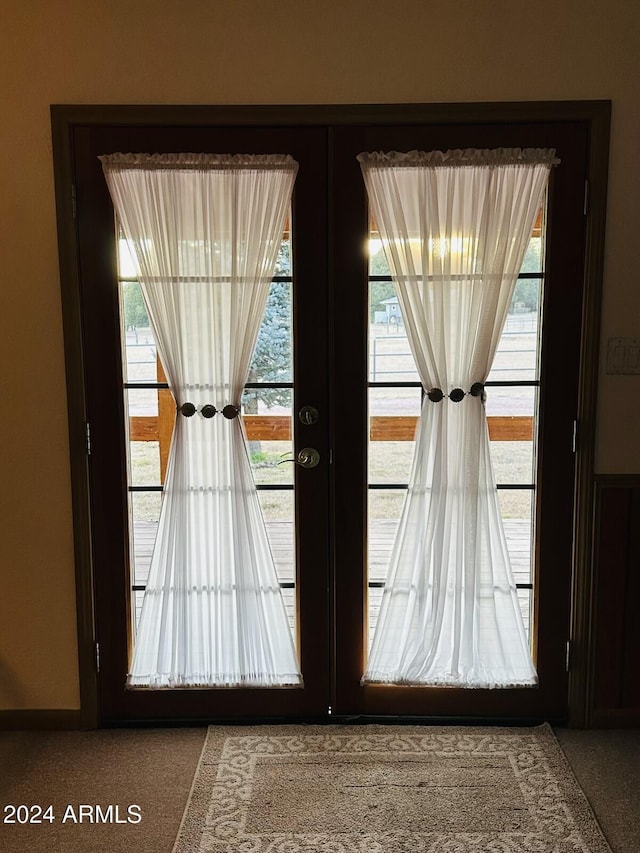 doorway to outside with french doors and plenty of natural light