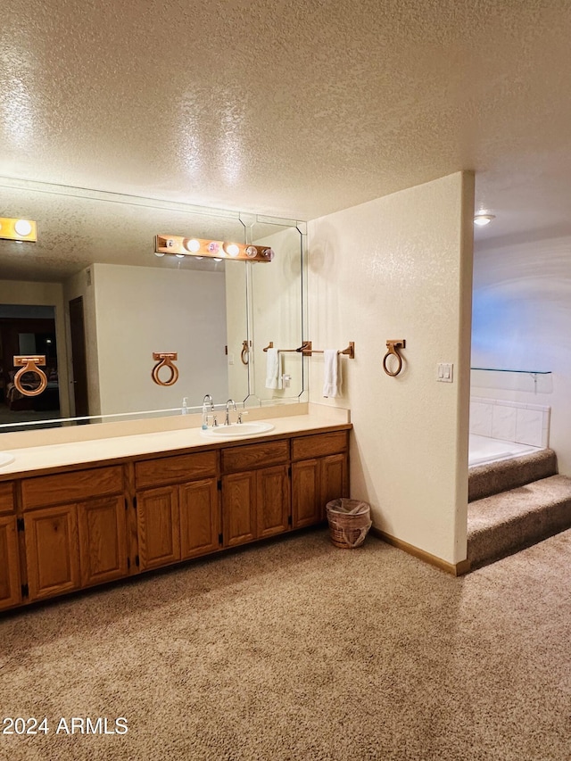 bathroom with vanity and a textured ceiling