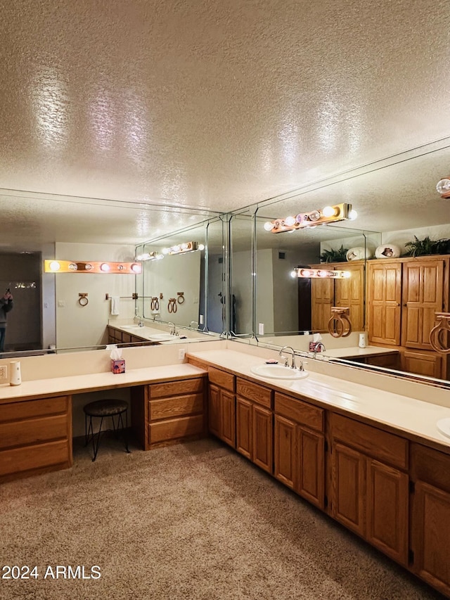 bathroom featuring vanity and a textured ceiling