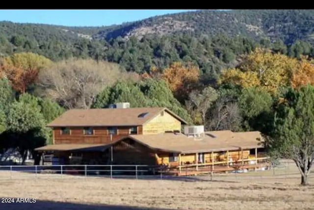 exterior space with a mountain view and a rural view