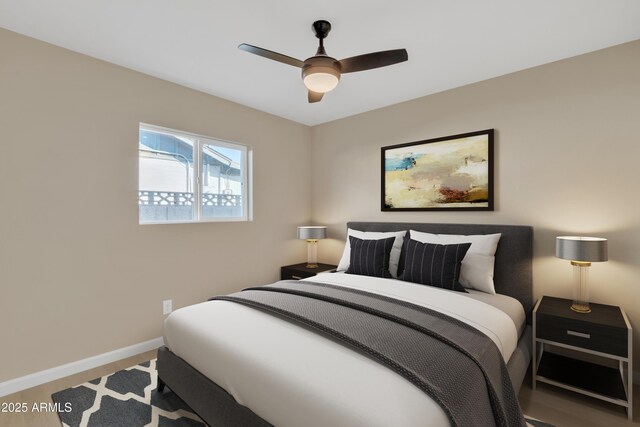7607 N 42nd Ln, Phoenix, AZ 85051 - bedroom featuring baseboards, ceiling fan, and wood finished floors