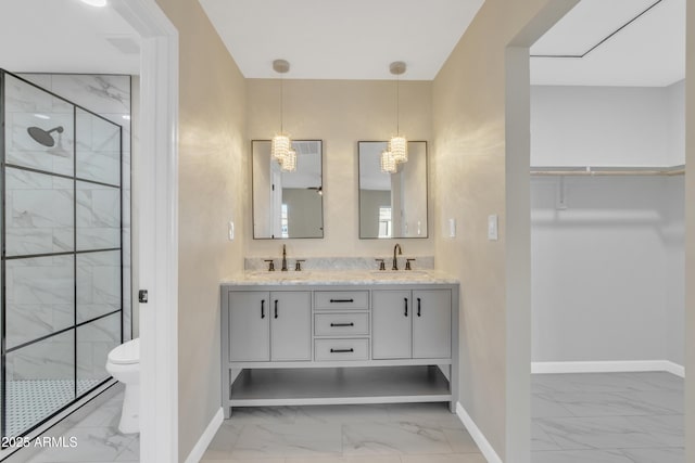 7607 N 42nd Ln, Phoenix, AZ 85051 - bathroom with marble finish floors, baseboards, a stall shower, toilet, and double vanity