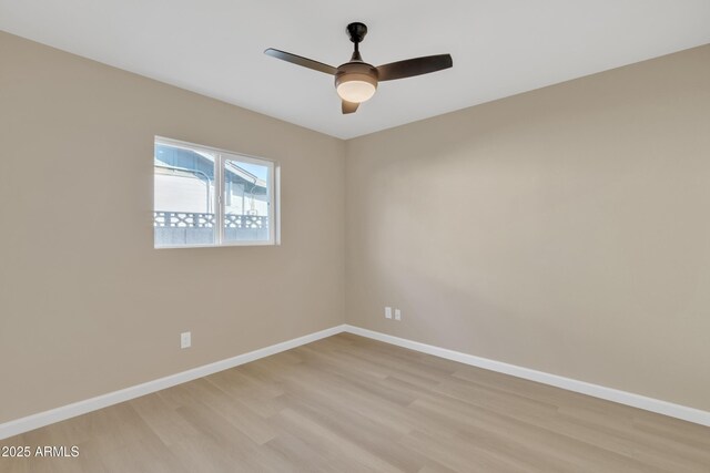 7607 N 42nd Ln, Phoenix, AZ 85051 - empty room featuring light wood-type flooring, baseboards, and a ceiling fan