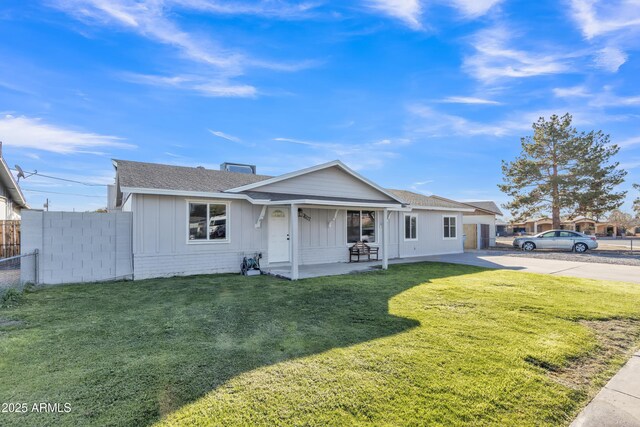 7607 N 42nd Ln, Phoenix, AZ 85051 - ranch-style home with a shingled roof, board and batten siding, a chimney, and concrete driveway