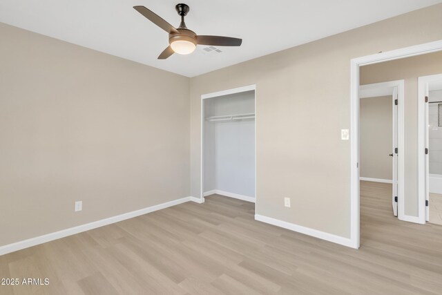 7607 N 42nd Ln, Phoenix, AZ 85051 - unfurnished bedroom with light wood-style flooring, baseboards, a closet, and a ceiling fan