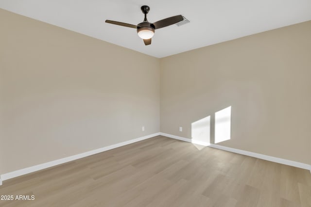 7607 N 42nd Ln, Phoenix, AZ 85051 - unfurnished room with wood finished floors, baseboards, and a ceiling fan